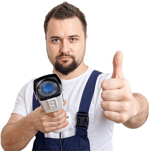 Technician posing while holding a security camera