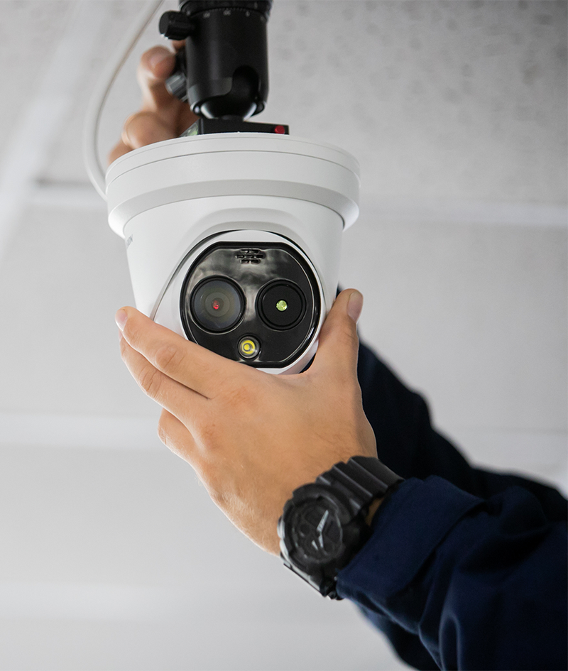 Professional technician configuring a CCTV system